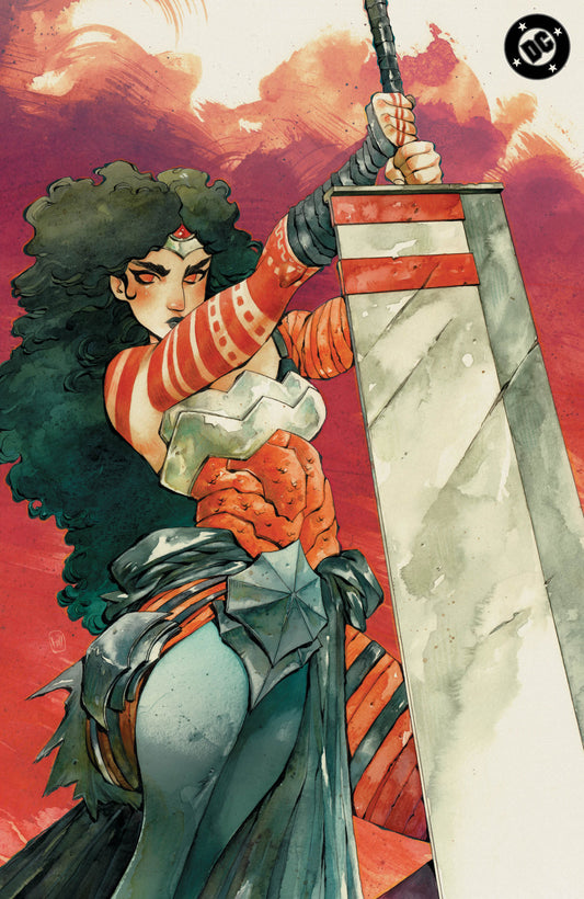 Comic book style illustration of a woman with dark curly hair holding a large sword, wearing red-and-white striped armor and a blue-gray skirt, against a fiery red and orange sky. A DC logo appears in the top-right corner.